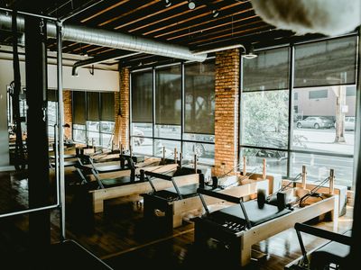 A calm, empty workout space with natural light from a window.